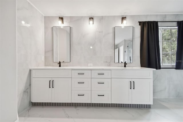 bathroom featuring tile walls and vanity