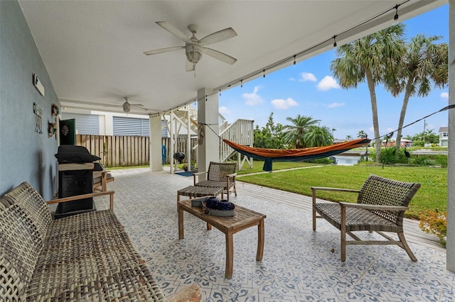 view of patio with ceiling fan and outdoor lounge area