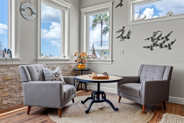 sitting room with hardwood / wood-style flooring