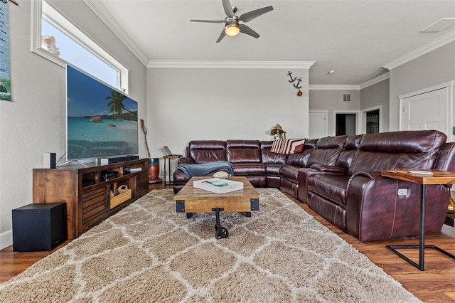 living room with ceiling fan, hardwood / wood-style flooring, and ornamental molding