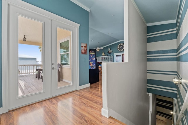 interior space featuring french doors, crown molding, and wood-type flooring