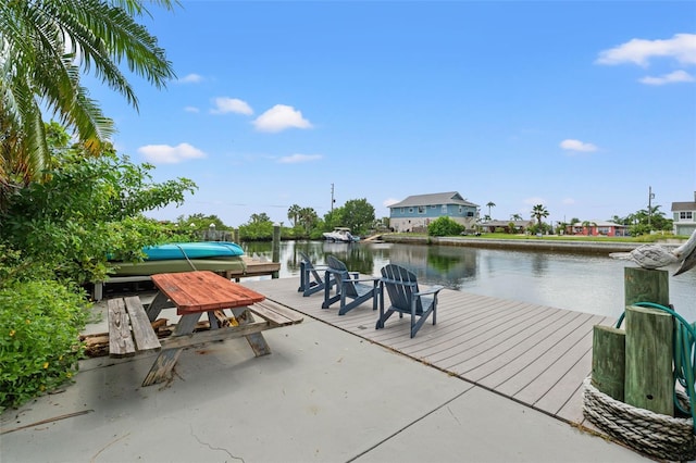 view of patio featuring a boat dock and a water view