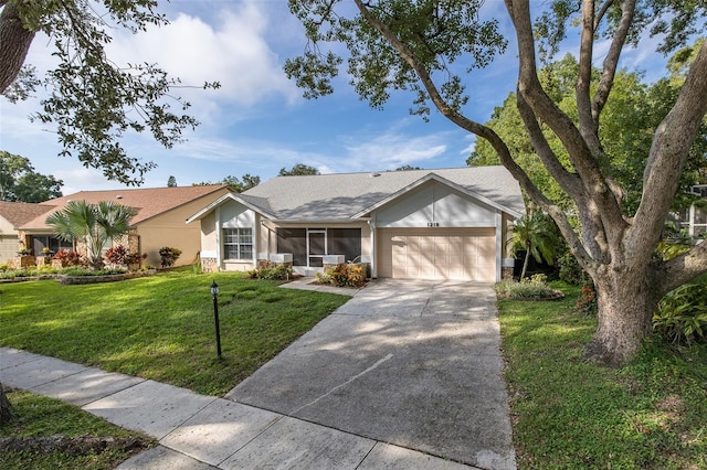 ranch-style home featuring a front yard and a garage