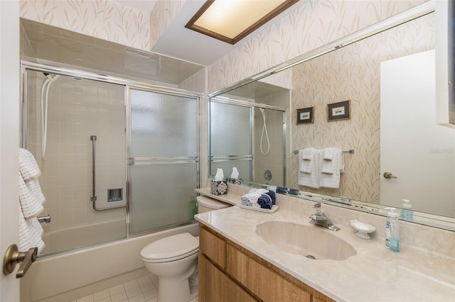 full bathroom featuring vanity, enclosed tub / shower combo, toilet, and tile patterned flooring