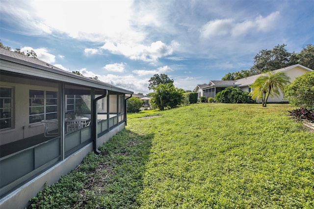 view of yard with a sunroom