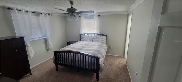 bedroom featuring ceiling fan, carpet, and a textured ceiling