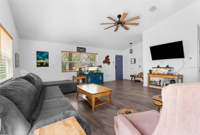 living room featuring lofted ceiling, ceiling fan, and dark hardwood / wood-style floors