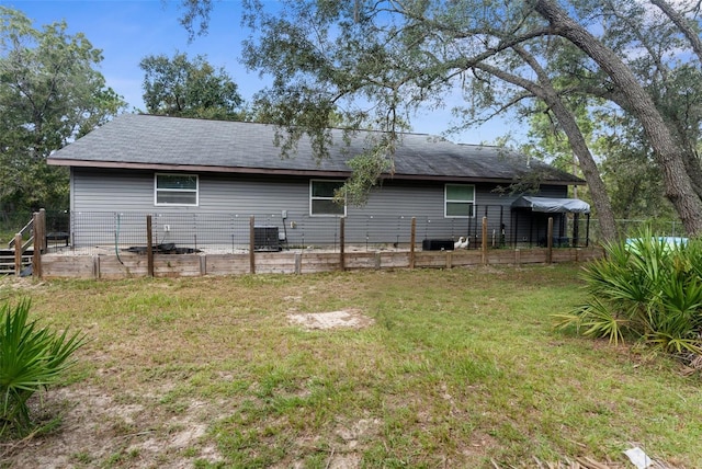 back of property featuring a yard and a patio