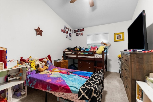 carpeted bedroom featuring ceiling fan and vaulted ceiling