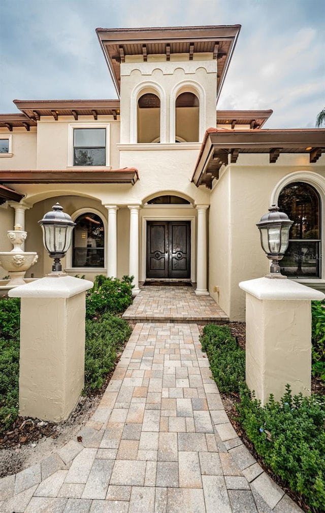9943 Milano Dr, Trinity, FL 34655 - property entrance featuring stucco siding