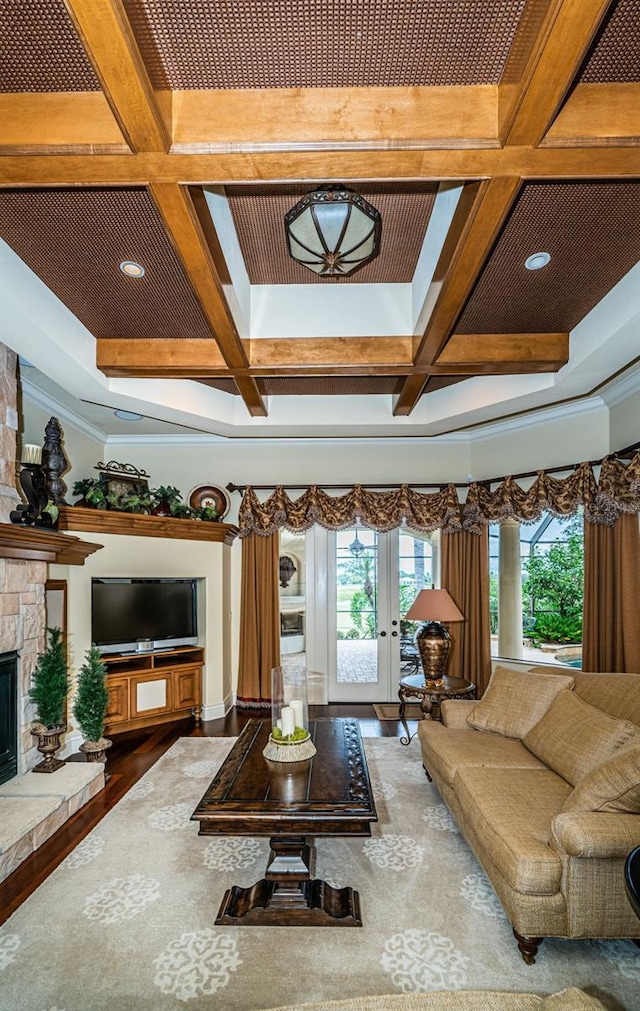 9943 Milano Dr, Trinity, FL 34655 - living area with coffered ceiling, beam ceiling, french doors, a fireplace, and wood finished floors