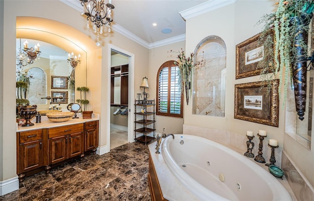 bathroom featuring ornamental molding, vanity, an inviting chandelier, and tiled bath