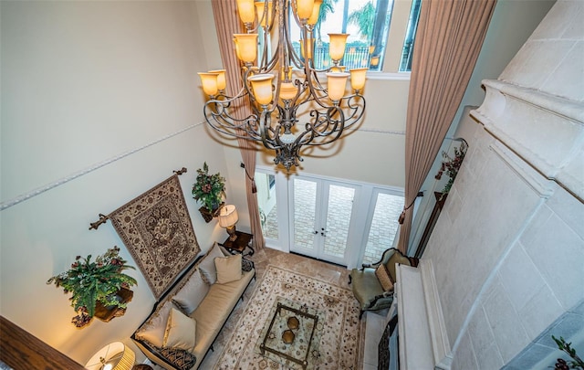 foyer entrance with a healthy amount of sunlight and a notable chandelier