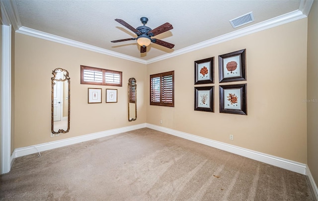 empty room with ornamental molding, a textured ceiling, ceiling fan, and carpet flooring