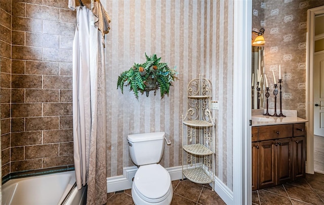 9943 Milano Dr, Trinity, FL 34655 - bathroom with tile patterned flooring, vanity, toilet, wallpapered walls, and shower / bath combo with shower curtain