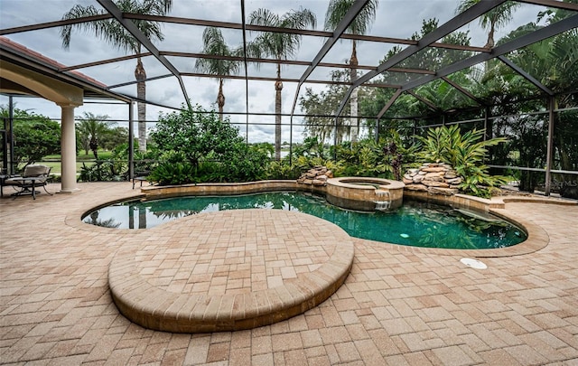 9943 Milano Dr, Trinity, FL 34655 - view of pool with a pool with connected hot tub, a lanai, and a patio