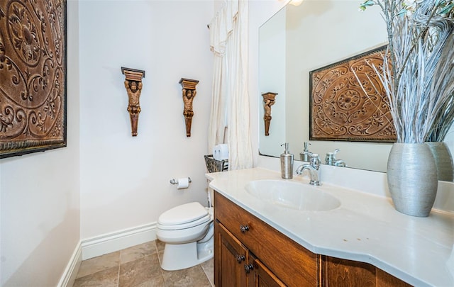 bathroom featuring toilet and vanity