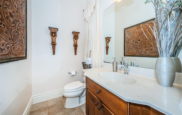 9943 Milano Dr, Trinity, FL 34655 - bathroom featuring toilet, vanity, and baseboards