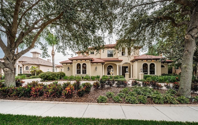 9943 Milano Dr, Trinity, FL 34655 - mediterranean / spanish home featuring stucco siding and a tiled roof