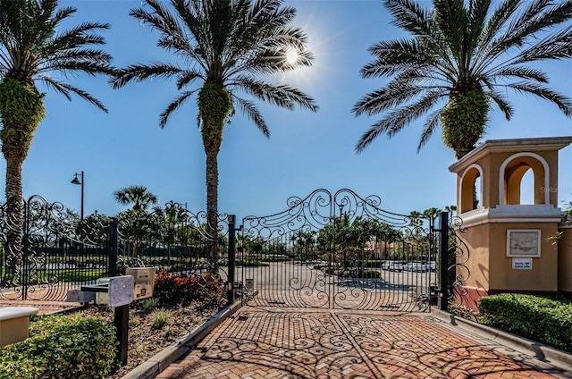 9943 Milano Dr, Trinity, FL 34655 - view of gate featuring fence