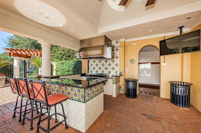 interior space featuring exterior kitchen and an outdoor bar