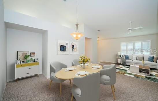 dining room featuring carpet