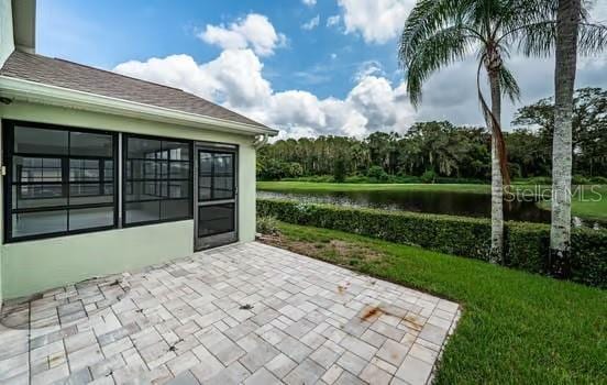 view of patio featuring a water view