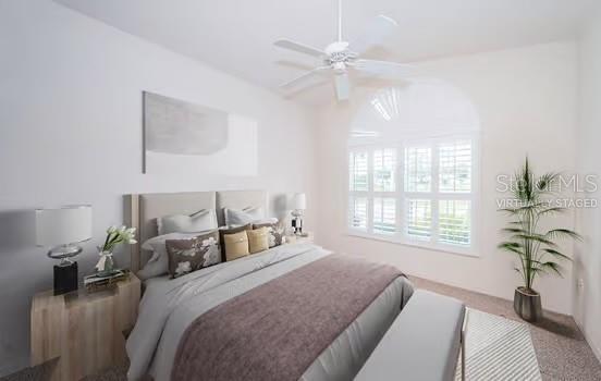 bedroom with ceiling fan and carpet flooring