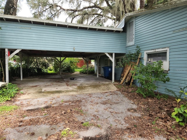 view of parking / parking lot featuring a carport