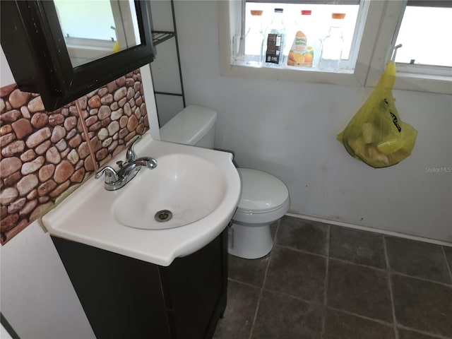 bathroom featuring vanity, toilet, and tile patterned floors