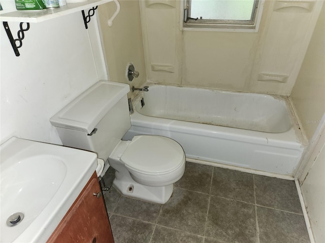 bathroom featuring tile patterned flooring, vanity, and toilet