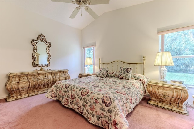 carpeted bedroom featuring vaulted ceiling and ceiling fan