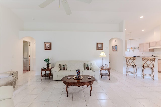 living room with light tile patterned floors and ceiling fan