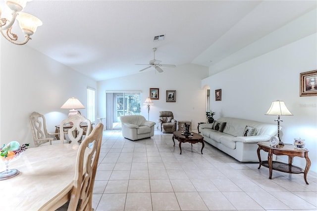 tiled living room featuring ceiling fan and vaulted ceiling