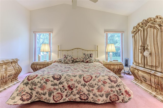 carpeted bedroom featuring lofted ceiling, ceiling fan, and multiple windows