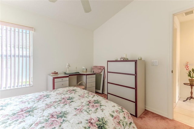 carpeted bedroom featuring lofted ceiling and ceiling fan