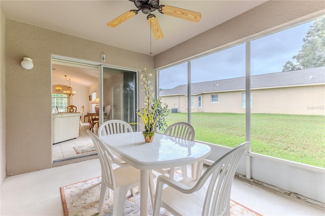 sunroom with ceiling fan