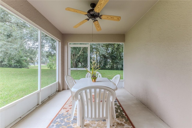 sunroom / solarium with ceiling fan and a wealth of natural light