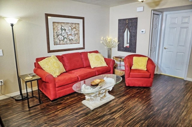 living room with baseboards and wood finished floors