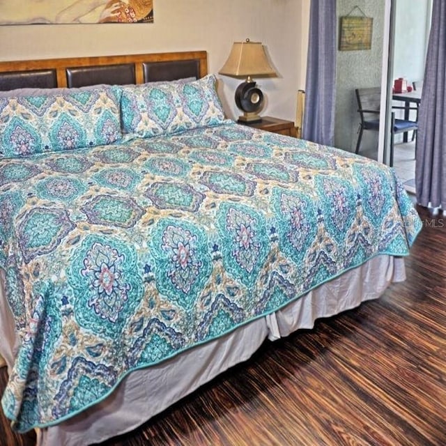 bedroom featuring wood finished floors