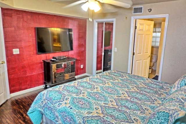 bedroom featuring visible vents, baseboards, a ceiling fan, and wood finished floors