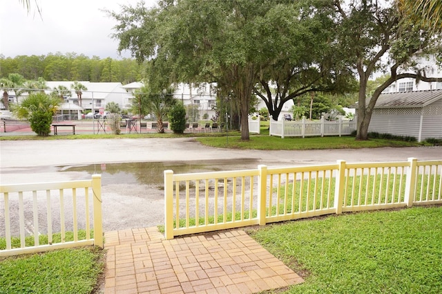view of yard featuring a residential view and fence