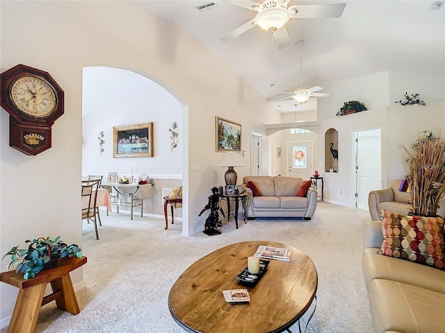 living room featuring light colored carpet, lofted ceiling, and ceiling fan