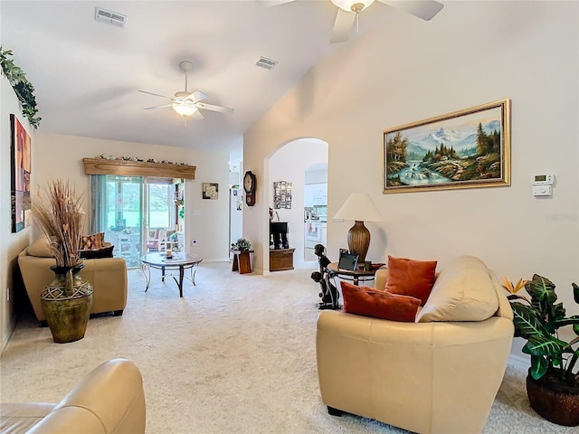 carpeted living room with lofted ceiling and ceiling fan