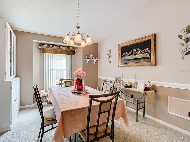 dining space with lofted ceiling, light colored carpet, and a notable chandelier