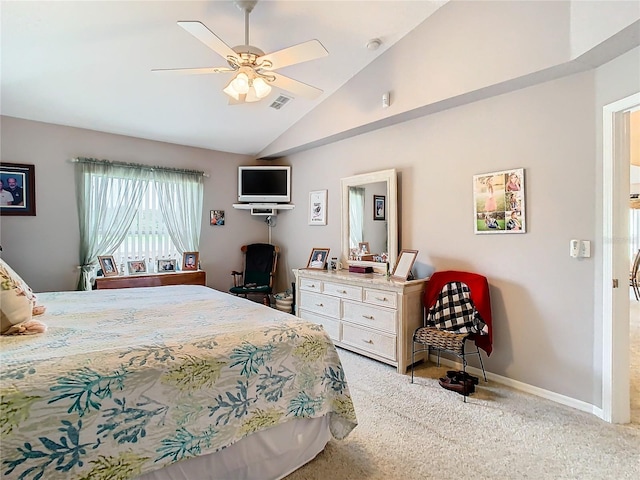 bedroom with lofted ceiling, ceiling fan, and light carpet