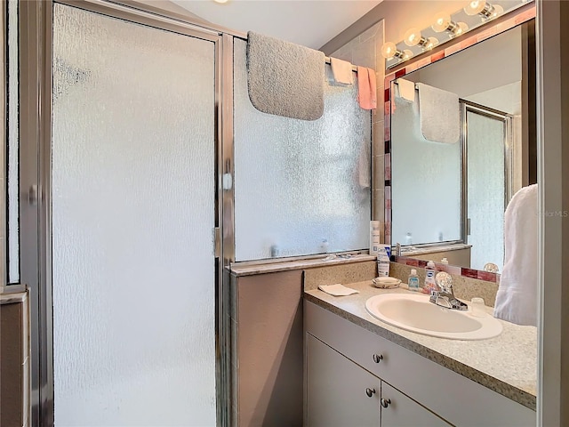 bathroom with vanity and an enclosed shower