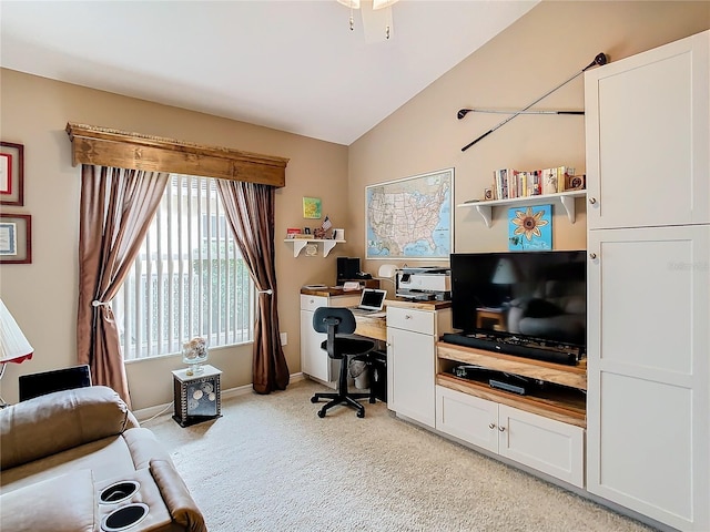 carpeted office featuring lofted ceiling