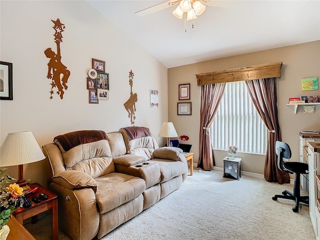 living room featuring ceiling fan, carpet floors, and vaulted ceiling