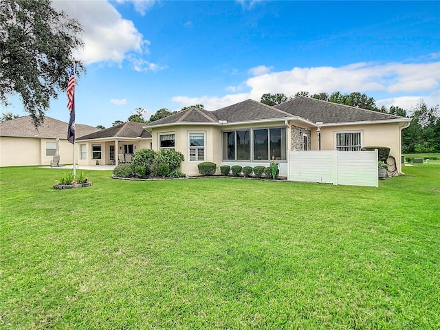 ranch-style home with a front yard